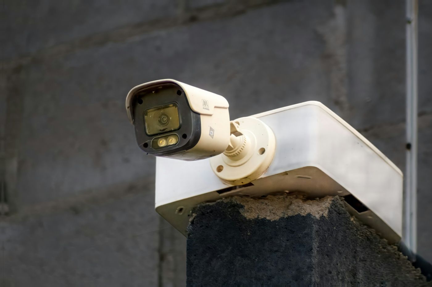 Outdoor security camera mounted on a wall